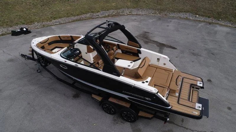 Slide: The Image of 2022 Chaparral 287 SSX boat on trailer, black and white exterior, brown interior. - 5