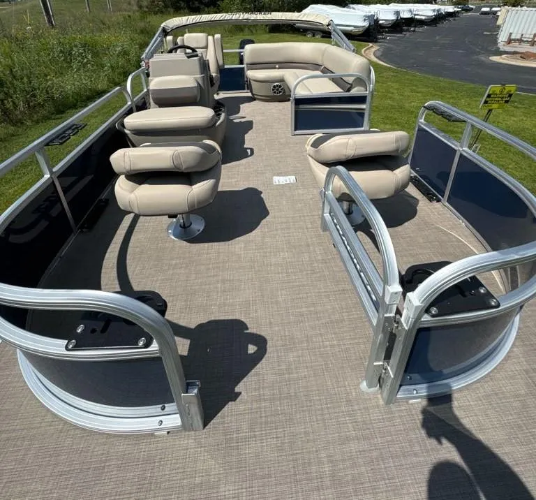 Slide: The Image of 2025 Sun Tracker Bass Buggy 16 XL Select pontoon boat with beige seating and open deck. - 8