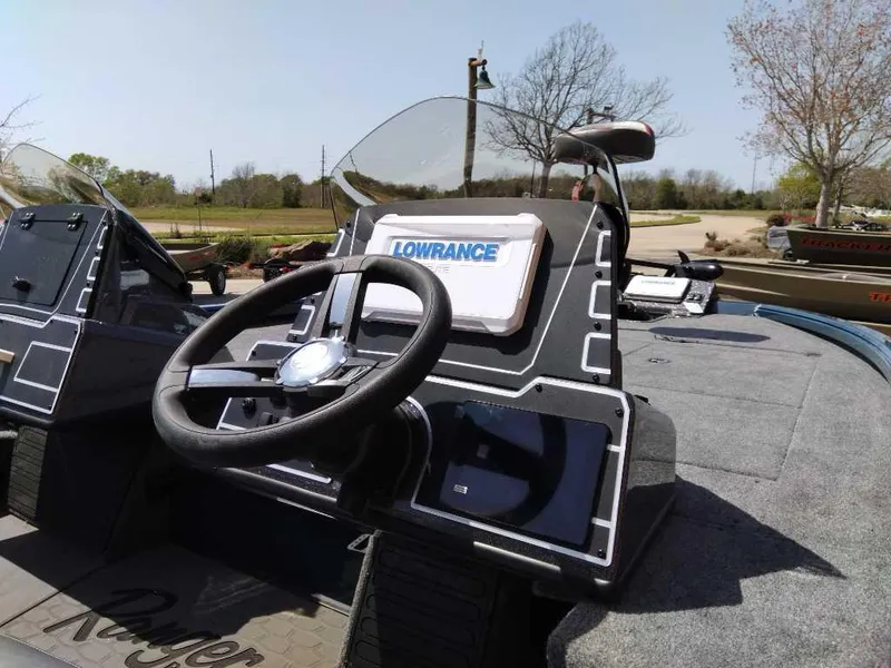 Slide: The Image of 2025 Ranger ALPHA 208 boat dashboard with Lowrance navigation system. - 3