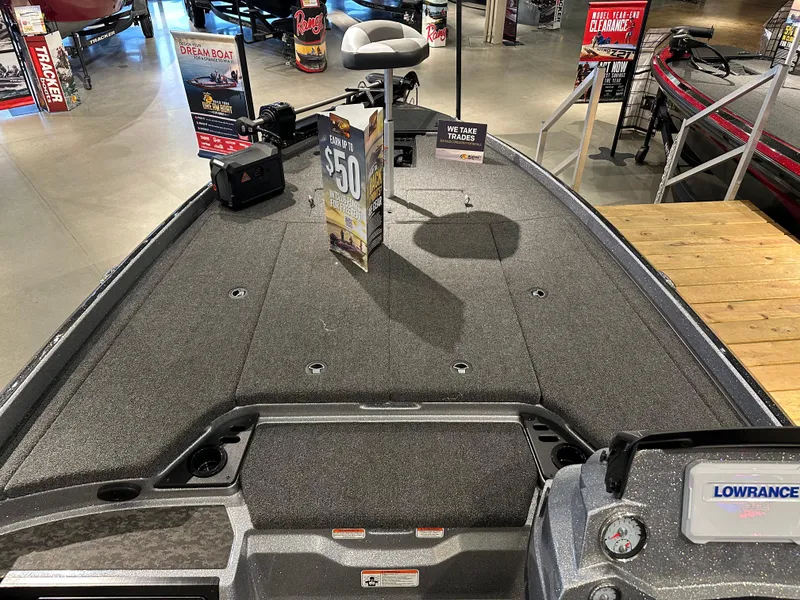 Slide: The Image of 2025 Nitro Z21 XL boat interior with fishing deck and Lowrance electronics display. - 2