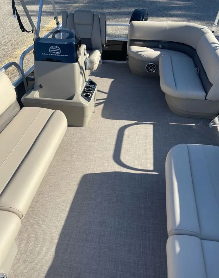 Slide: The Image of 2025 Sun Tracker Party Barge 16 DLX interior with spacious seating and modern design. - 5