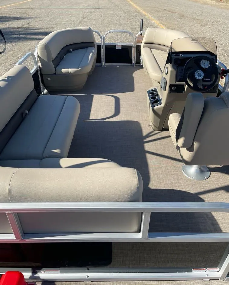 Slide: The Image of 2025 Sun Tracker Party Barge 16 DLX pontoon boat interior with beige seating. - 7
