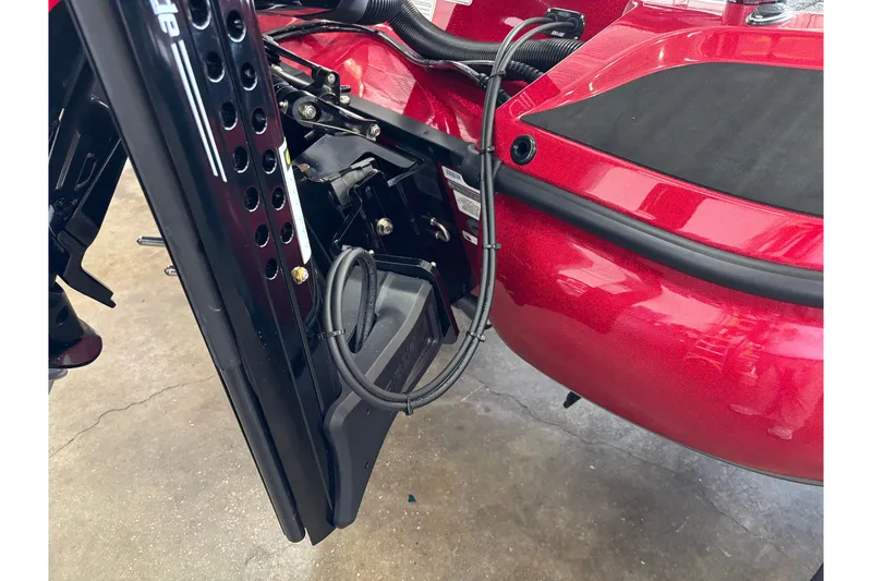Slide: The Image of Close-up of a 2025 Nitro Z19 boat's red hull and black mounting hardware. - 3