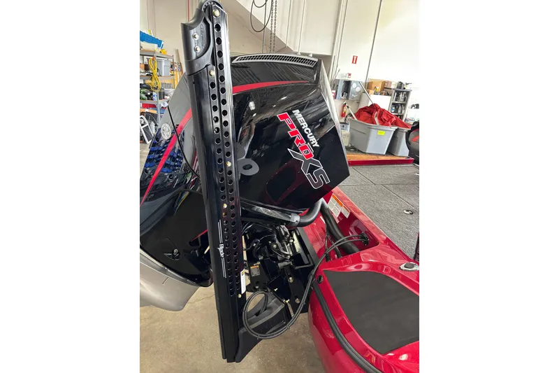 Slide: The Image of 2025 Nitro Z19 boat with Mercury Pro XS engine in a workshop setting. - 2