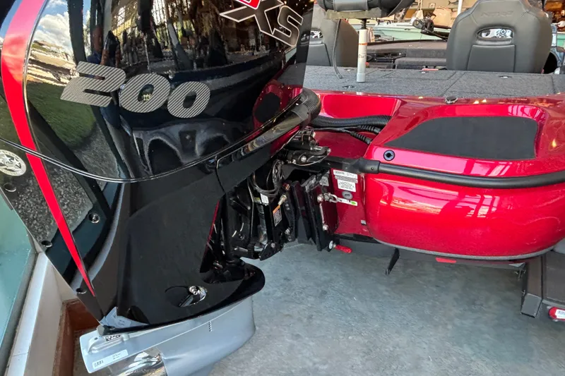 Slide: The Image of 2025 Nitro Z19 boat with powerful 200 horsepower engine, sleek red and black design. - 1