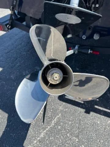 Slide: The Image of 2025 Tracker Pro Guide V-175 Combo boat propeller on asphalt surface. - 4