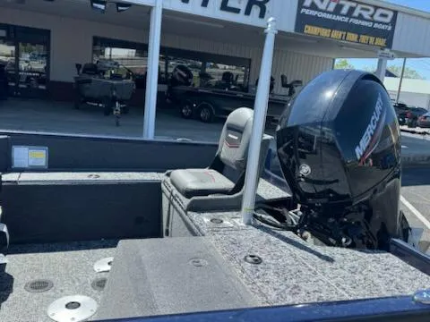 Slide: The Image of 2025 Tracker Pro Guide V-175 Combo boat with Mercury engine at dealership. - 5