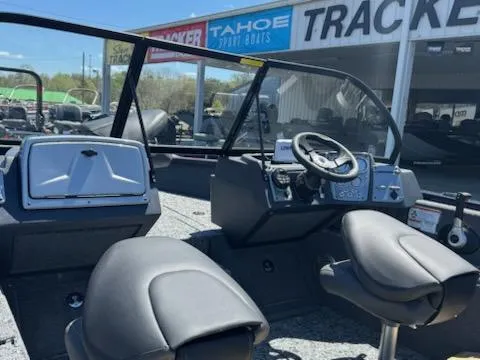 Slide: The Image of 2025 Tracker Pro Guide V-175 Combo boat interior with steering wheel and seating. - 6