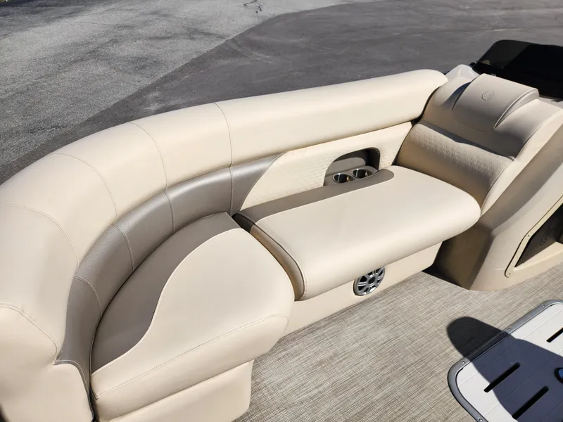 Slide: The Image of 2020 Premier 230 Sun Station boat with beige seating and cup holders. - 11
