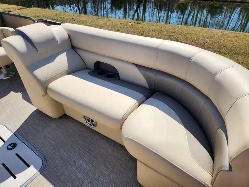 Slide: The Image of Luxurious seating on 2020 Premier 230 Sun Station pontoon boat, featuring beige upholstery. - 12