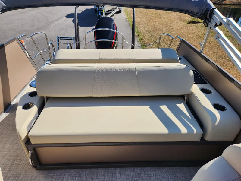 Slide: The Image of 2020 Premier 230 Sun Station boat with beige seating and cup holders. - 13