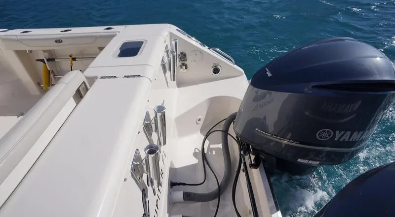 Slide: The Image of 2014 Pursuit OS 345 Offshore boat with Yamaha outboard engine on blue water. - 13