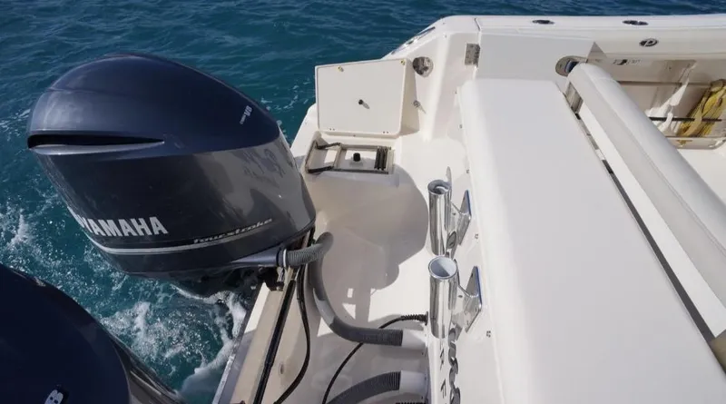 Slide: The Image of 2014 Pursuit OS 345 Offshore boat with Yamaha outboard motor on blue ocean water. - 14