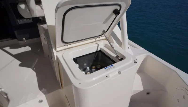 Slide: The Image of Open cooler on 2014 Pursuit OS 345 Offshore boat deck with drinks inside. - 19
