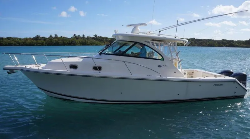 Slide: The Image of 2014 Pursuit OS 345 Offshore boat on calm blue water, clear sky background. - 4