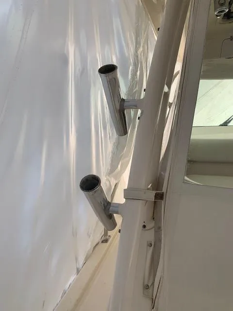 Slide: The Image of 2014 Pursuit OS 345 Offshore boat rod holders on deck. - 41