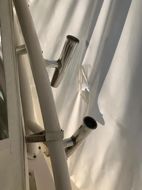 Slide: The Image of 2014 Pursuit OS 345 Offshore boat with stainless steel rod holders. - 42