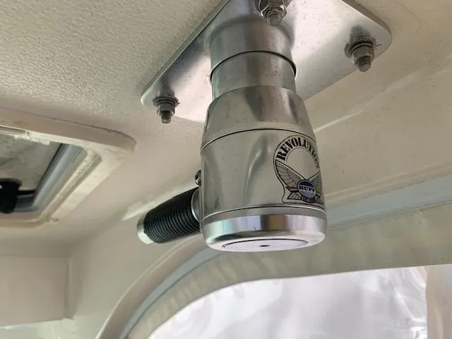 Slide: The Image of Ceiling-mounted marine light fixture on a 2014 Pursuit OS 345 Offshore boat. - 43