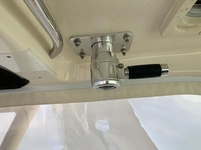 Slide: The Image of 2014 Pursuit OS 345 Offshore boat interior detail with mounted metal fitting. - 44