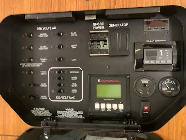 Slide: The Image of Electrical control panel of a 2014 Pursuit OS 345 Offshore boat. - 48