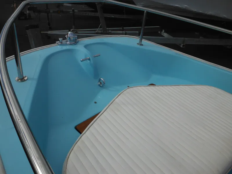 Slide: The Image of 1998 Boston Whaler 13 Sport boat interior with blue deck and white seating. - 14