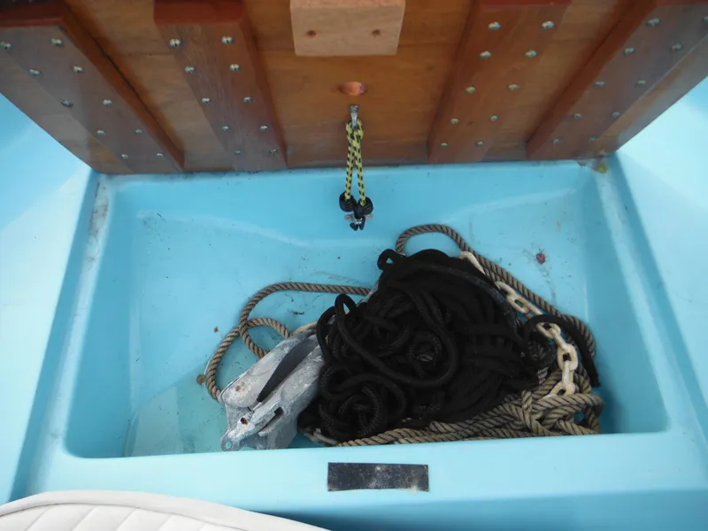 Slide: The Image of Storage compartment of a 1998 Boston Whaler 13 Sport with ropes and anchor. - 23