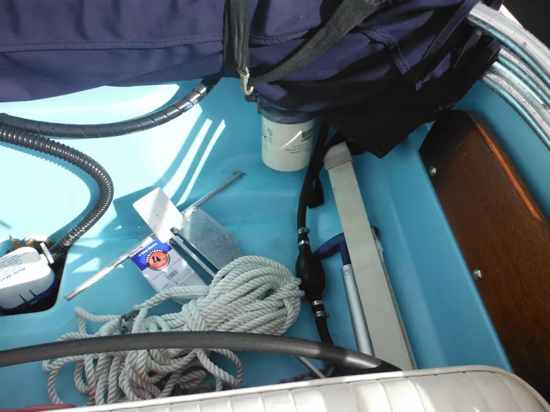 Slide: The Image of Interior of a 1998 Boston Whaler 13 Sport boat with ropes and equipment. - 25