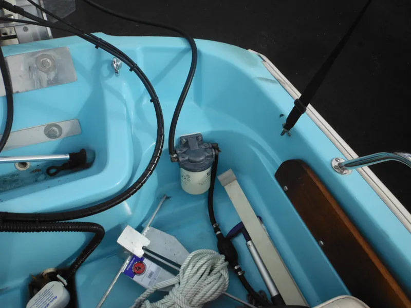 Slide: The Image of Interior view of a 1998 Boston Whaler 13 Sport boat, showing equipment and wiring. - 28