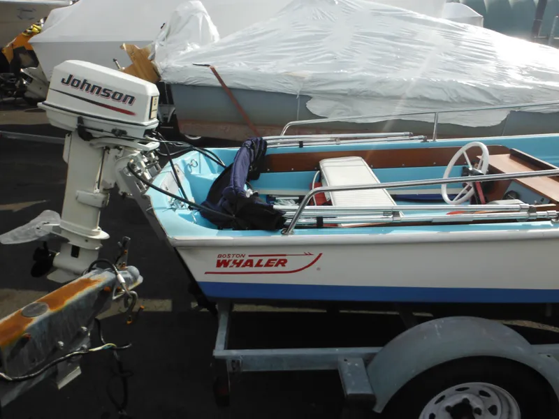 Slide: The Image of 1998 Boston Whaler 13 Sport boat with Johnson outboard motor on a trailer. - 3