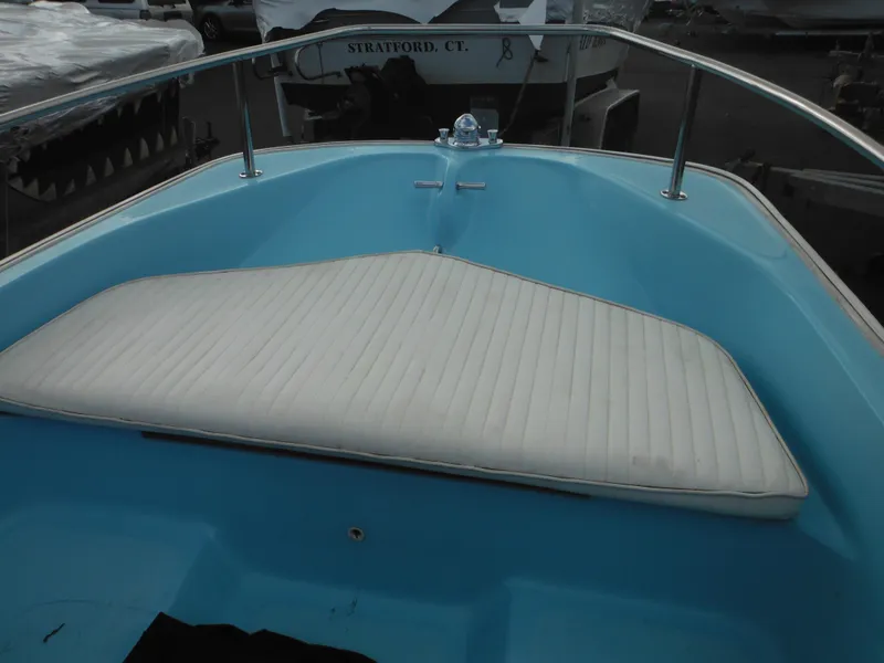 Slide: The Image of 1998 Boston Whaler 13 Sport boat interior with white cushioned seating. - 30