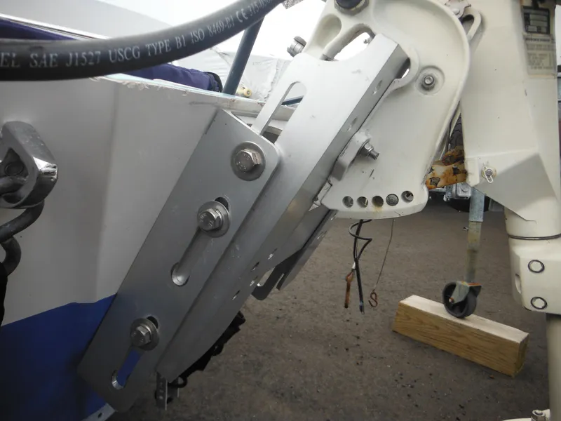 Slide: The Image of Close-up of a 1998 Boston Whaler 13 Sport boat motor mount and hardware. - 32