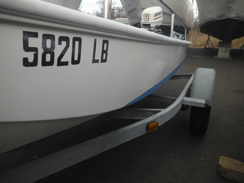 Slide: The Image of 1998 Boston Whaler 13 Sport boat on trailer, registration number 5820 LB visible. - 37