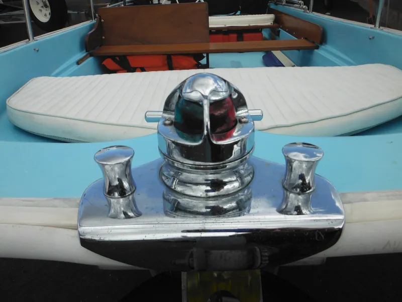 Slide: The Image of 1998 Boston Whaler 13 Sport boat interior with chrome fittings and white seating. - 38