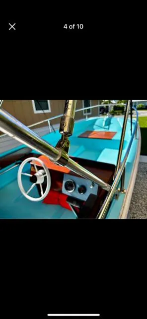 Slide: The Image of 1998 Boston Whaler 13 Sport boat interior with steering wheel and dashboard. - 43