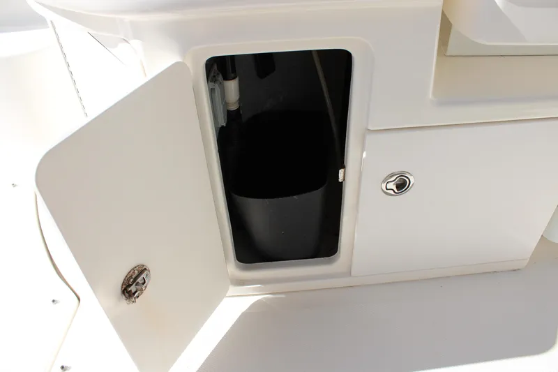 Slide: The Image of Open storage compartment on a 2005 Sea Ray 340 Sundancer boat. - 17