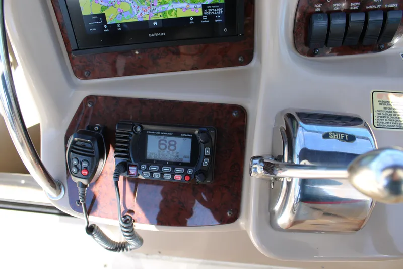 Slide: The Image of Control panel of 2005 Sea Ray 340 Sundancer with radio and navigation display. - 19