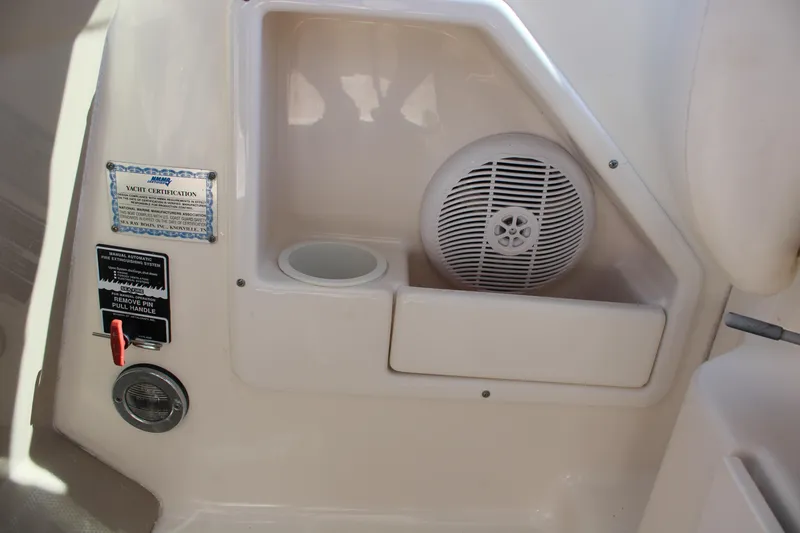 Slide: The Image of 2005 Sea Ray 340 Sundancer interior speaker and control panel. - 22