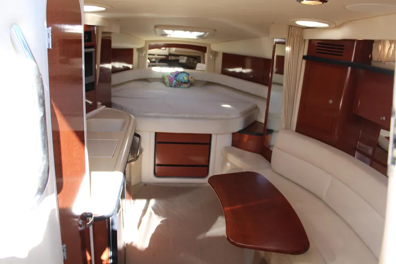 Slide: The Image of Interior of 2005 Sea Ray 340 Sundancer yacht with cozy seating and elegant wood finishes. - 23