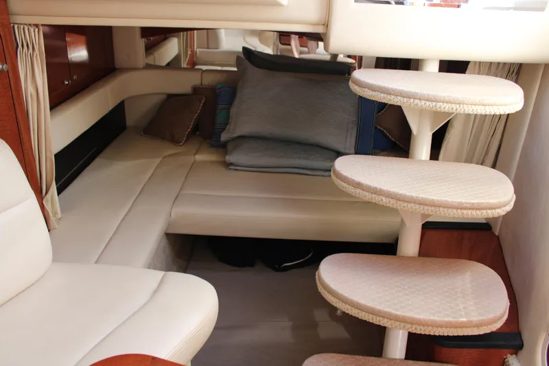 Slide: The Image of Interior of 2005 Sea Ray 340 Sundancer with cozy seating and stylish staircase. - 24