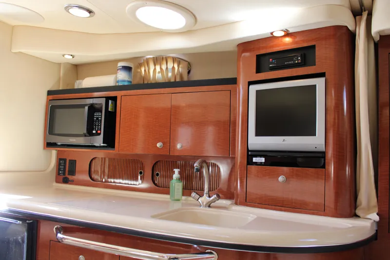 Slide: The Image of Interior of 2005 Sea Ray 340 Sundancer yacht with microwave, TV, and sink. - 29