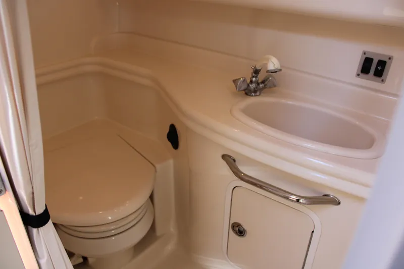 Slide: The Image of 2005 Sea Ray 340 Sundancer bathroom with sink and toilet. - 35