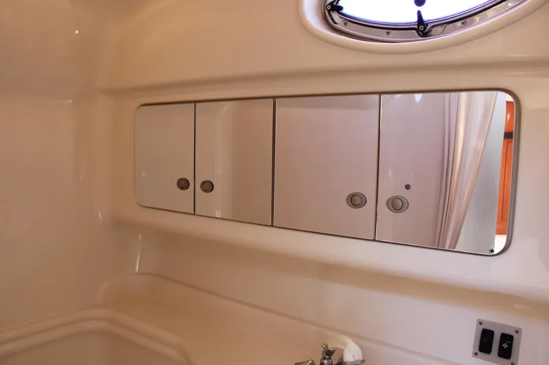 Slide: The Image of Interior of 2005 Sea Ray 340 Sundancer yacht bathroom with mirrored cabinets. - 36