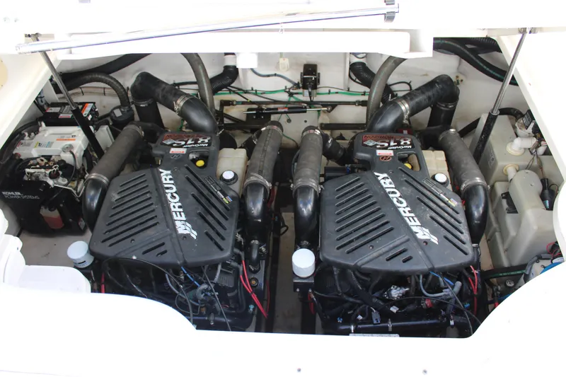 Slide: The Image of Engine compartment of 2005 Sea Ray 340 Sundancer with twin Mercury engines. - 37