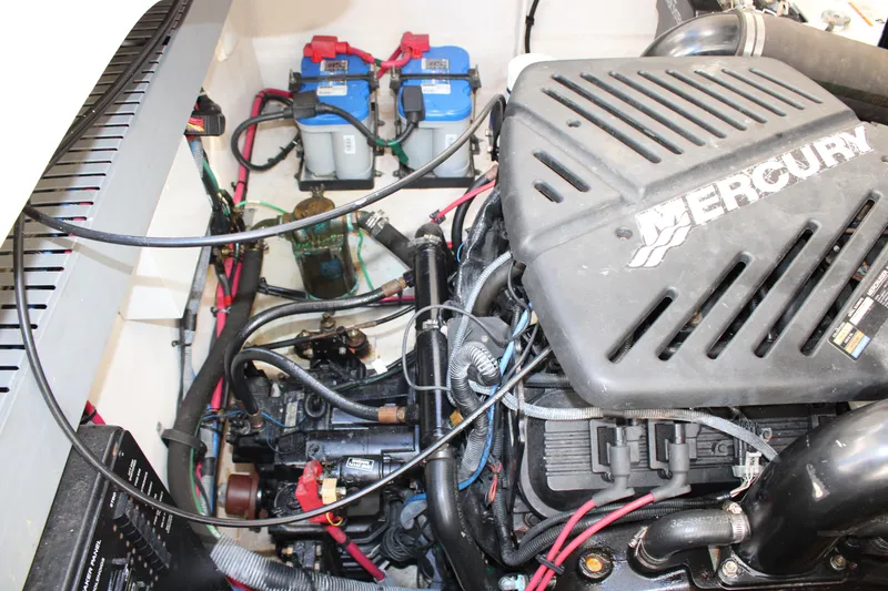 Slide: The Image of Engine compartment of 2005 Sea Ray 340 Sundancer with Mercury engine and battery setup. - 38