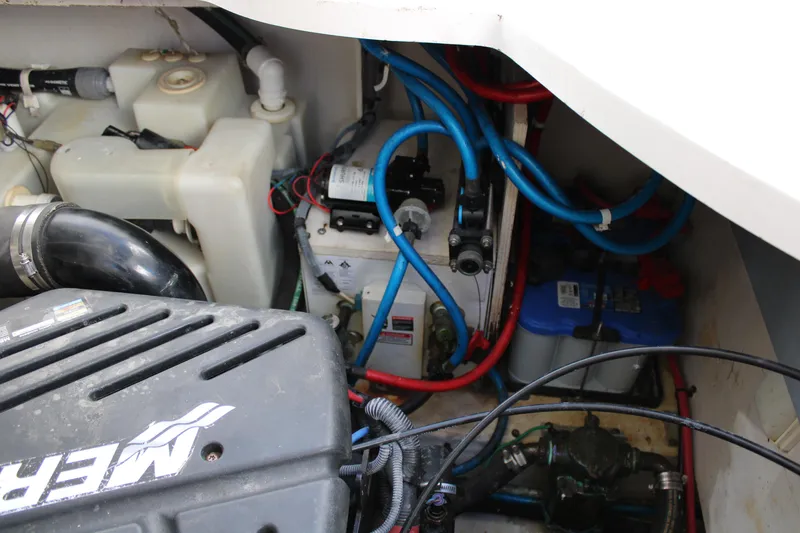Slide: The Image of Engine compartment of a 2005 Sea Ray 340 Sundancer with visible wiring and components. - 39