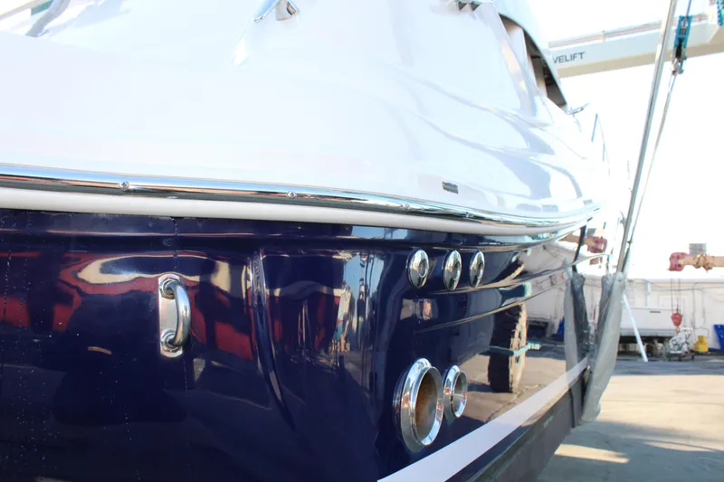 Slide: The Image of 2005 Sea Ray 340 Sundancer boat, close-up of sleek hull design. - 6