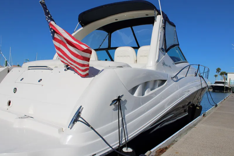 Slide: The Image of 2005 Sea Ray 340 Sundancer yacht docked with American flag. - 9