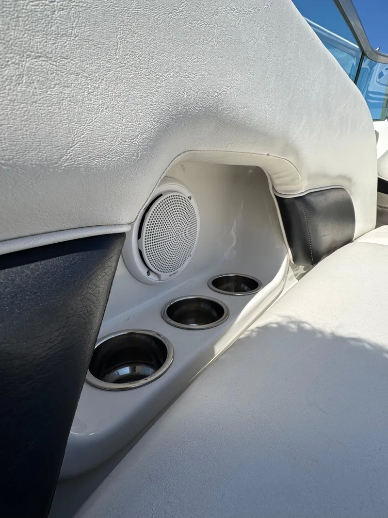 Slide: The Image of Interior of 2008 Crownline 270 BR boat with cup holders and speaker. - 5