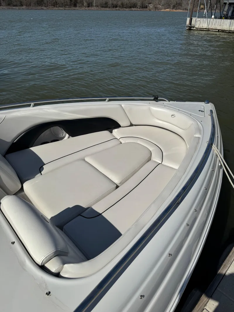 Slide: The Image of 2008 Crownline 270 BR boat with spacious seating on calm water. - 7