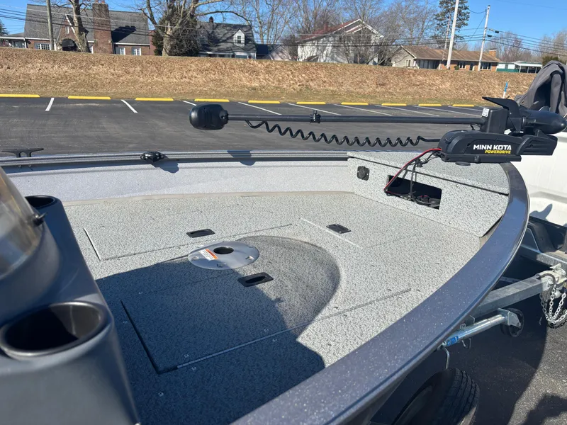 Slide: The Image of 2021 Crestliner 1650 Discovery SC boat with Minn Kota trolling motor in parking lot. - 11